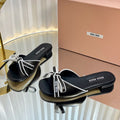 Miu Slides Sandals In Black With White Border Calfskin Bow In Trap